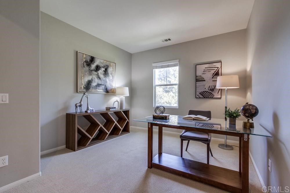 3400 Filoli Circle Carlsbad, CA 92009 - Photo 29 of 42 a bedroom with furniture and a window