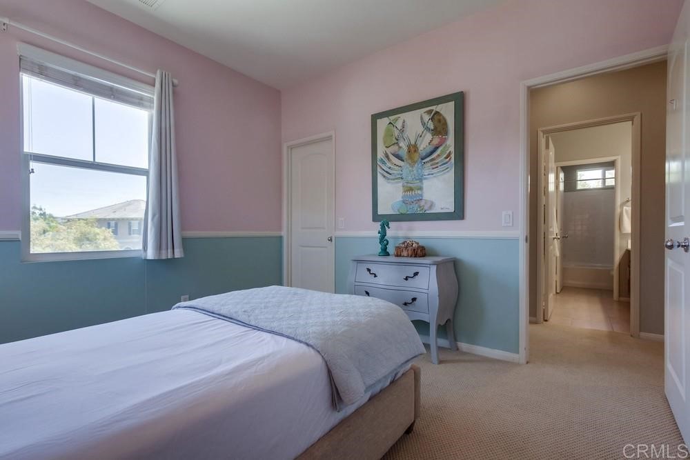 3400 Filoli Circle Carlsbad, CA 92009 - Photo 31 of 42 a bedroom with a bed and a window