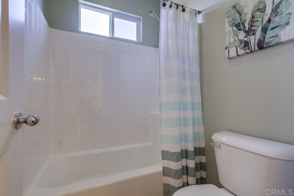 3400 Filoli Circle Carlsbad, CA 92009 - Photo 35 of 42 a bathroom with a toilet and a bathtub