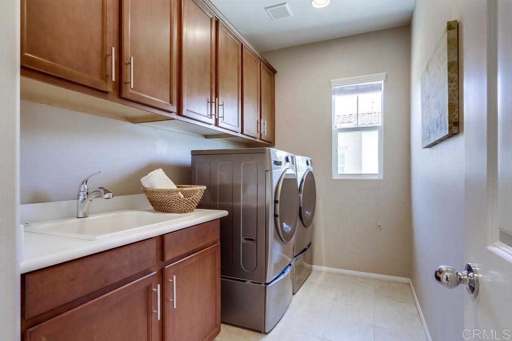 3400 Filoli Circle Carlsbad, CA 92009 - Photo 36 of 42 a utility room with closet dryer and washer