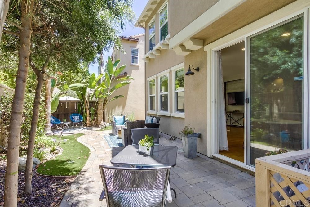 3400 Filoli Circle Carlsbad, CA 92009 - Photo 39 of 42 a view of a patio with couches table and chairs and potted plants