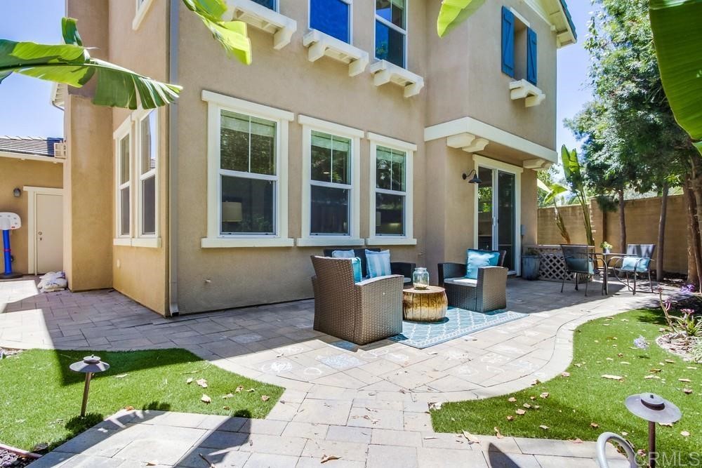 3400 Filoli Circle Carlsbad, CA 92009 - Photo 41 of 42 a view of the house with backyard and sitting area