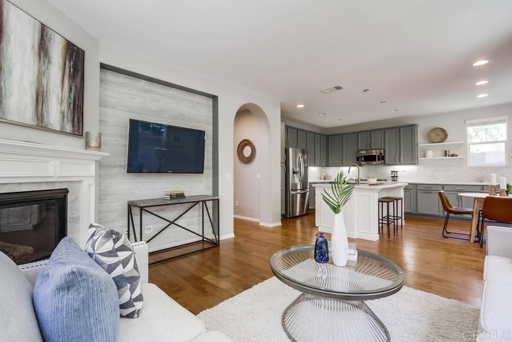 3400 Filoli Circle Carlsbad, CA 92009 - Photo 9 of 42 a living room with furniture and a fireplace