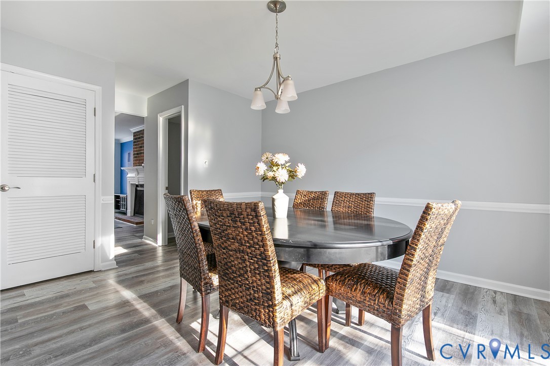 34 Brandywine Court Colonial Heights, VA 23834 - Photo 11 of 30 a dining room with furniture a chandelier and wooden floor