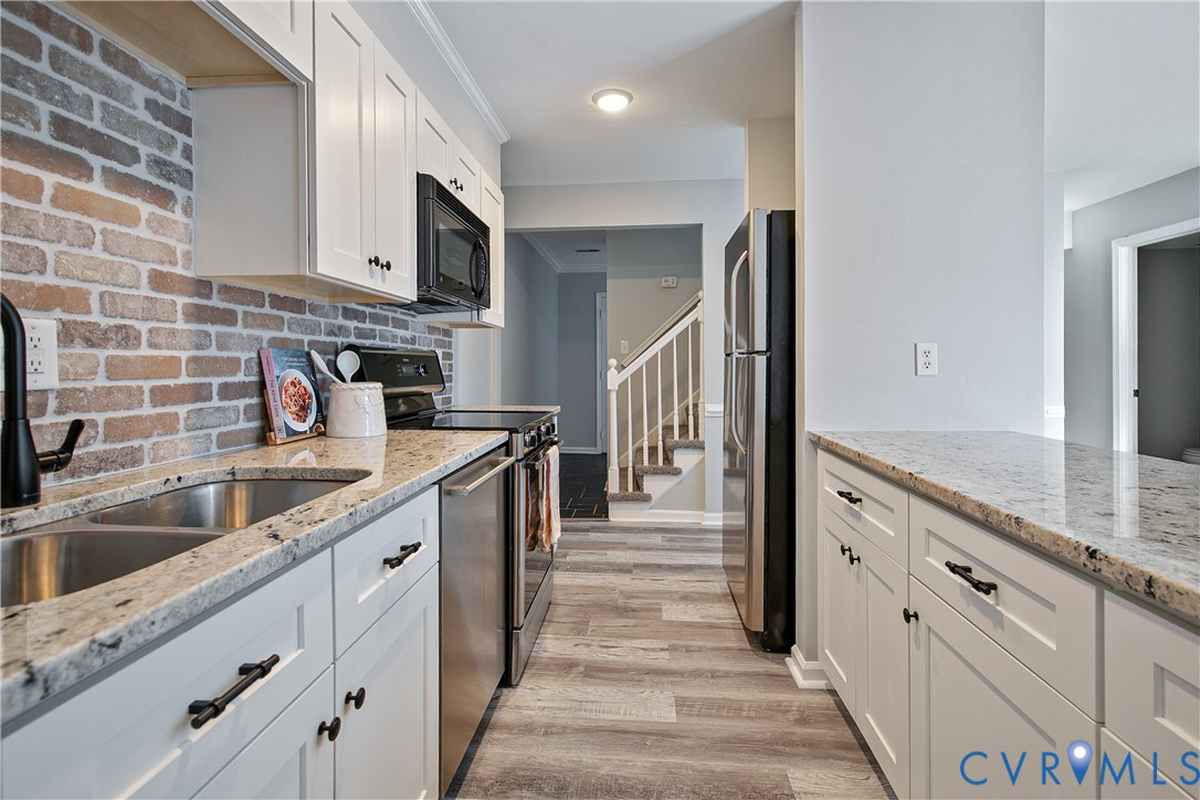 34 Brandywine Court Colonial Heights, VA 23834 - Photo 13 of 30 a kitchen with stainless steel appliances granite countertop a sink and a stove top oven