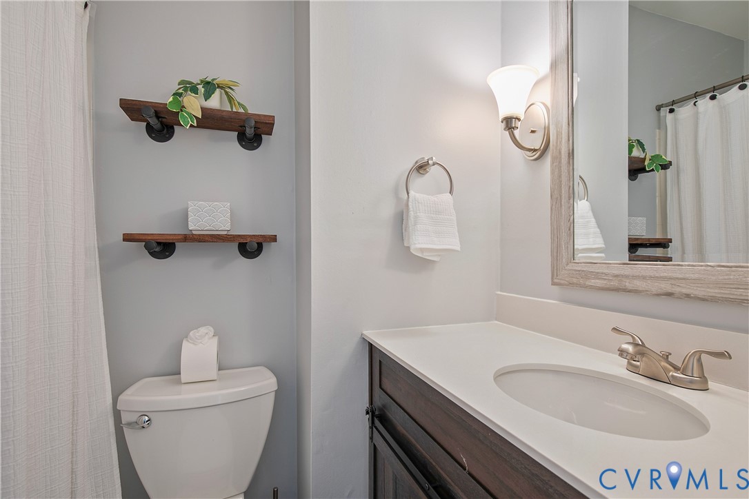 34 Brandywine Court Colonial Heights, VA 23834 - Photo 27 of 30 a bathroom with a toilet sink and mirror