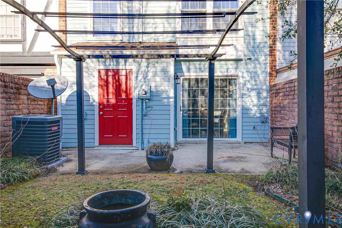 34 Brandywine Court Colonial Heights, VA 23834 - Photo 29 of 30 a view of a porch with a chair and potted plants