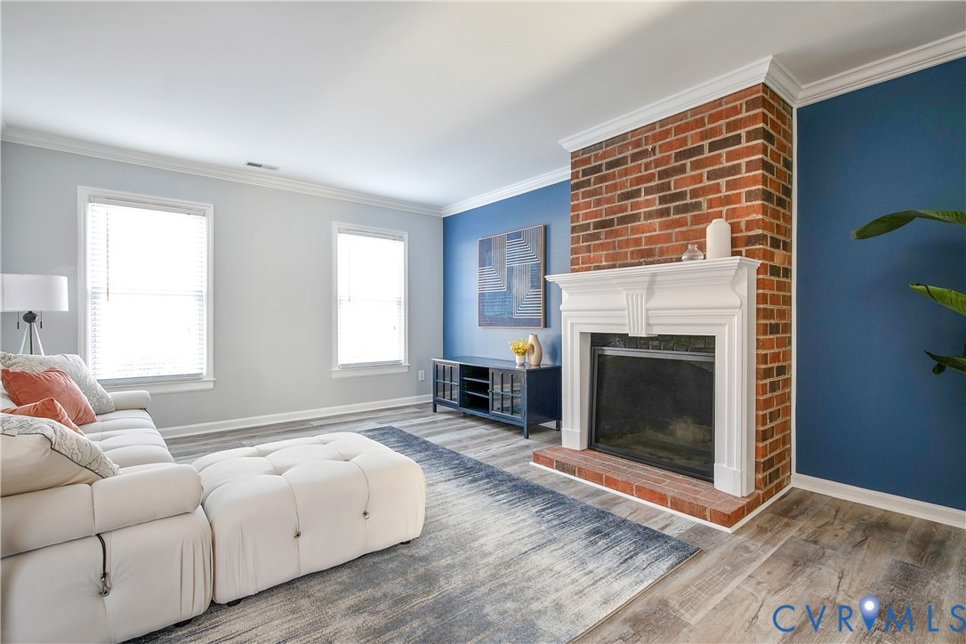 34 Brandywine Court Colonial Heights, VA 23834 - Photo 4 of 30 a living room with furniture a fireplace and a table