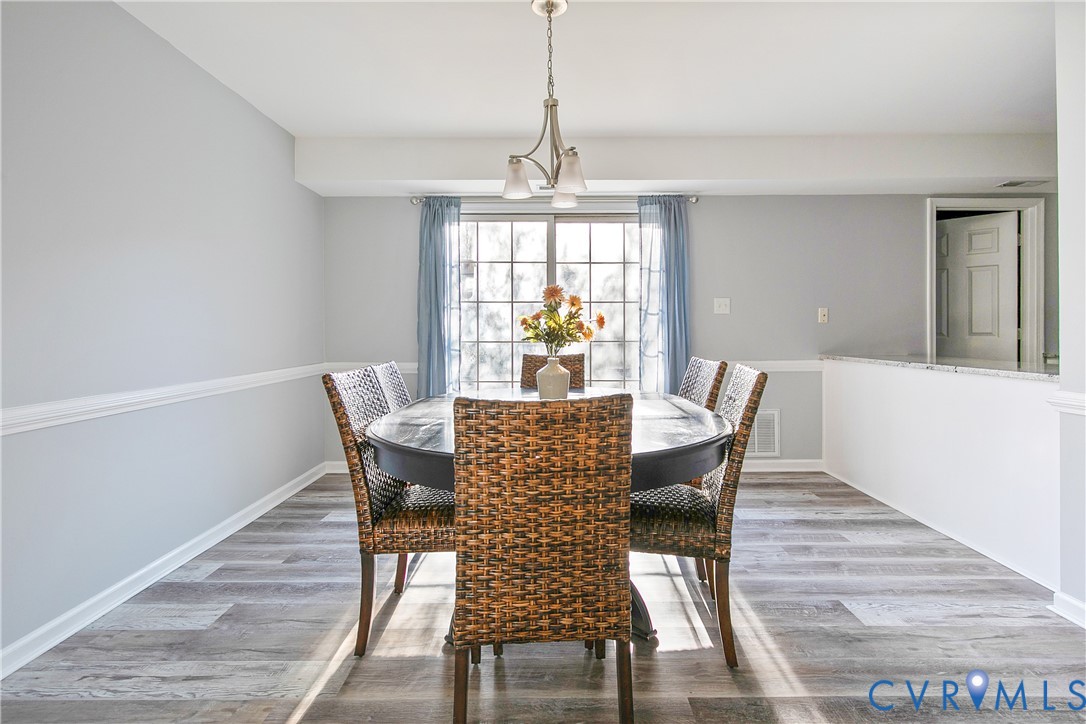 34 Brandywine Court Colonial Heights, VA 23834 - Photo 9 of 30 a view of a dining room with furniture window and wooden floor