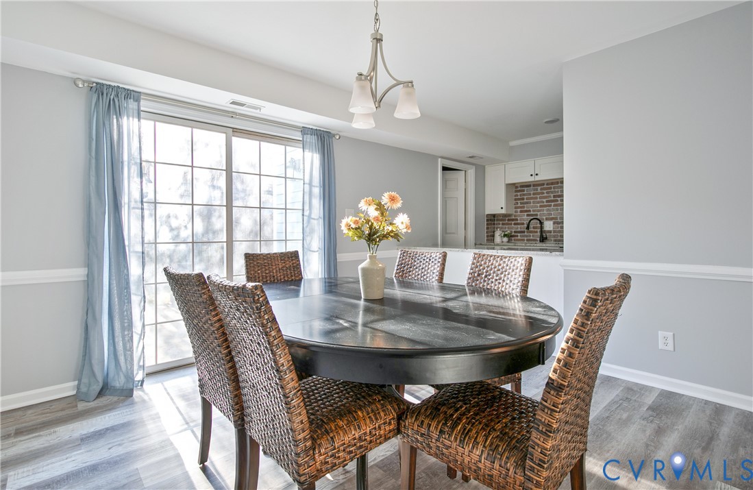 34 Brandywine Court Colonial Heights, VA 23834 - Photo 10 of 30 a view of a dining room with furniture and chandelier