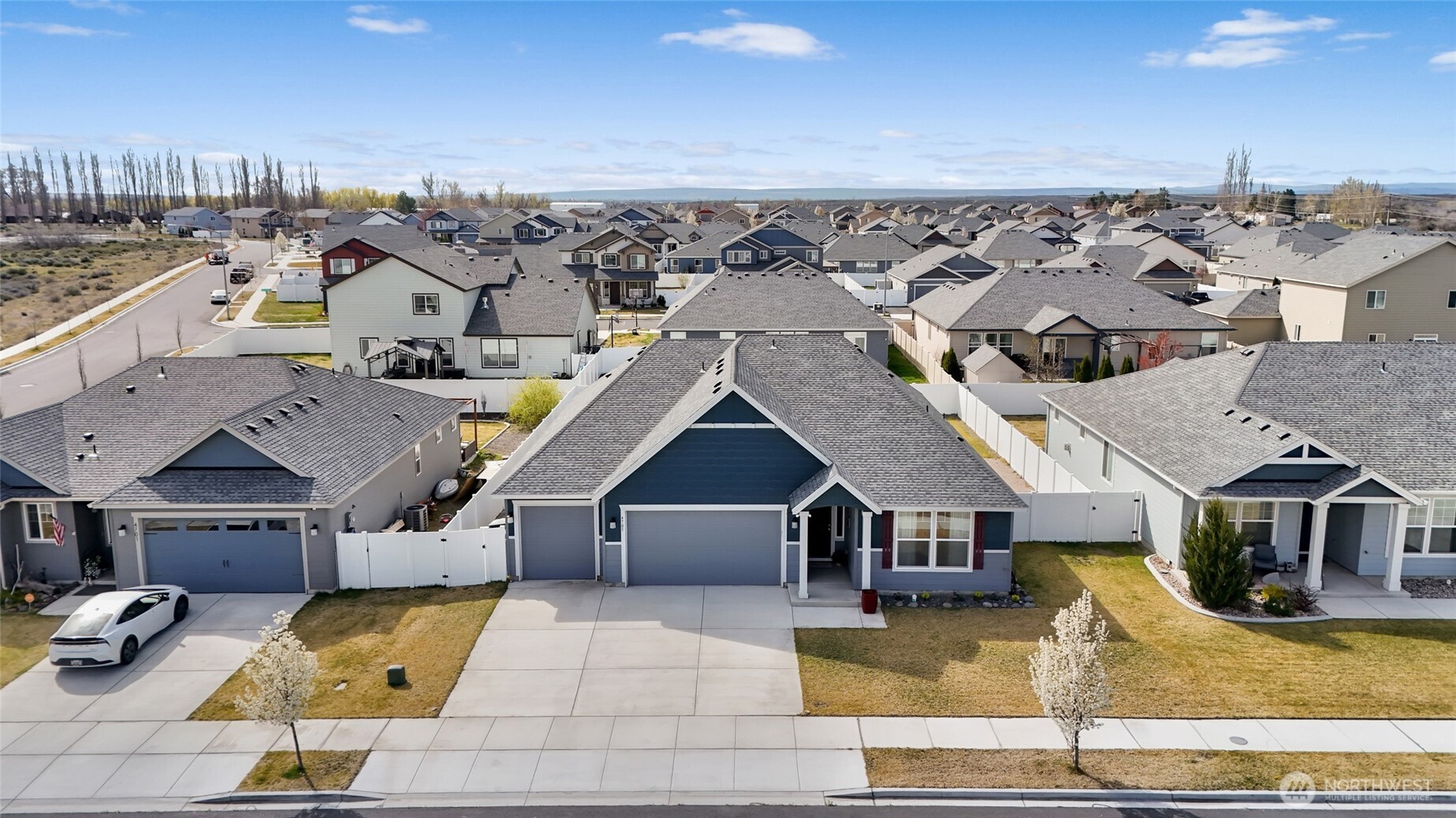 4705 West Merlin Street Moses Lake, WA 98837 - Photo 1 of 33 an aerial view of a house with swimming pool