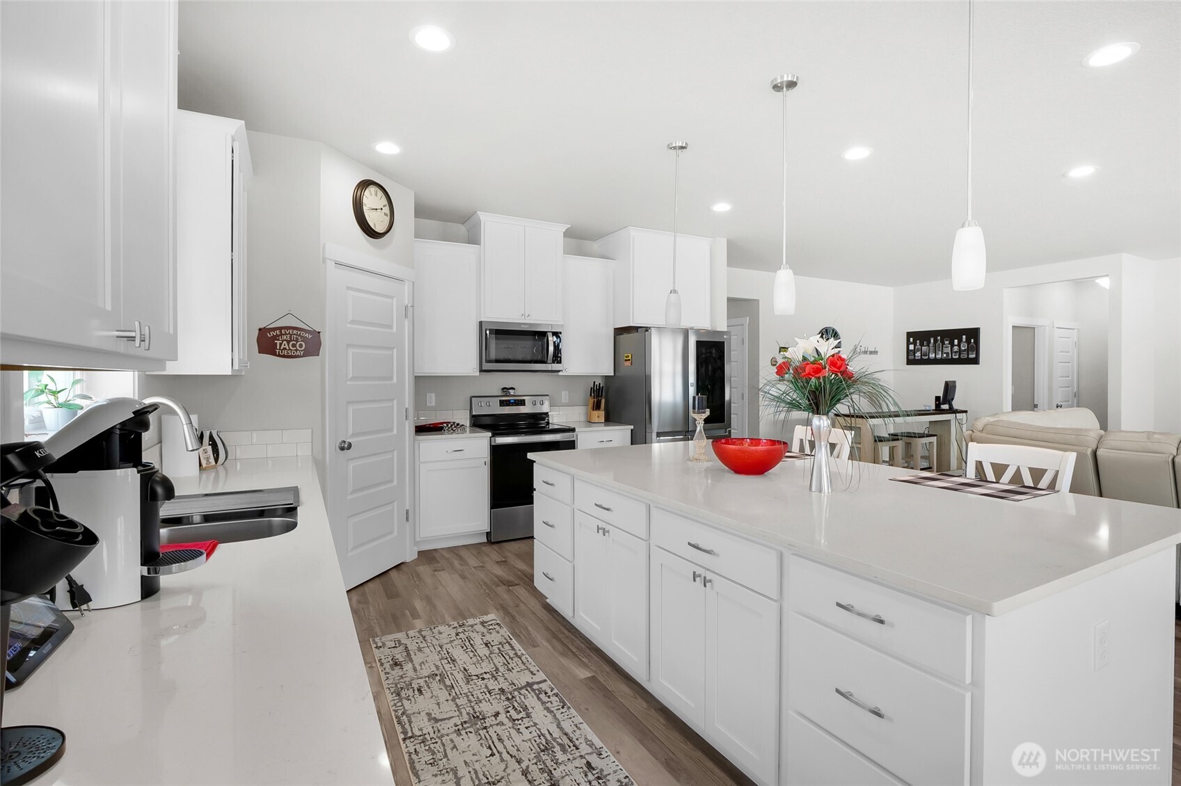 4705 West Merlin Street Moses Lake, WA 98837 - Photo 13 of 33 a kitchen with white cabinets and appliances