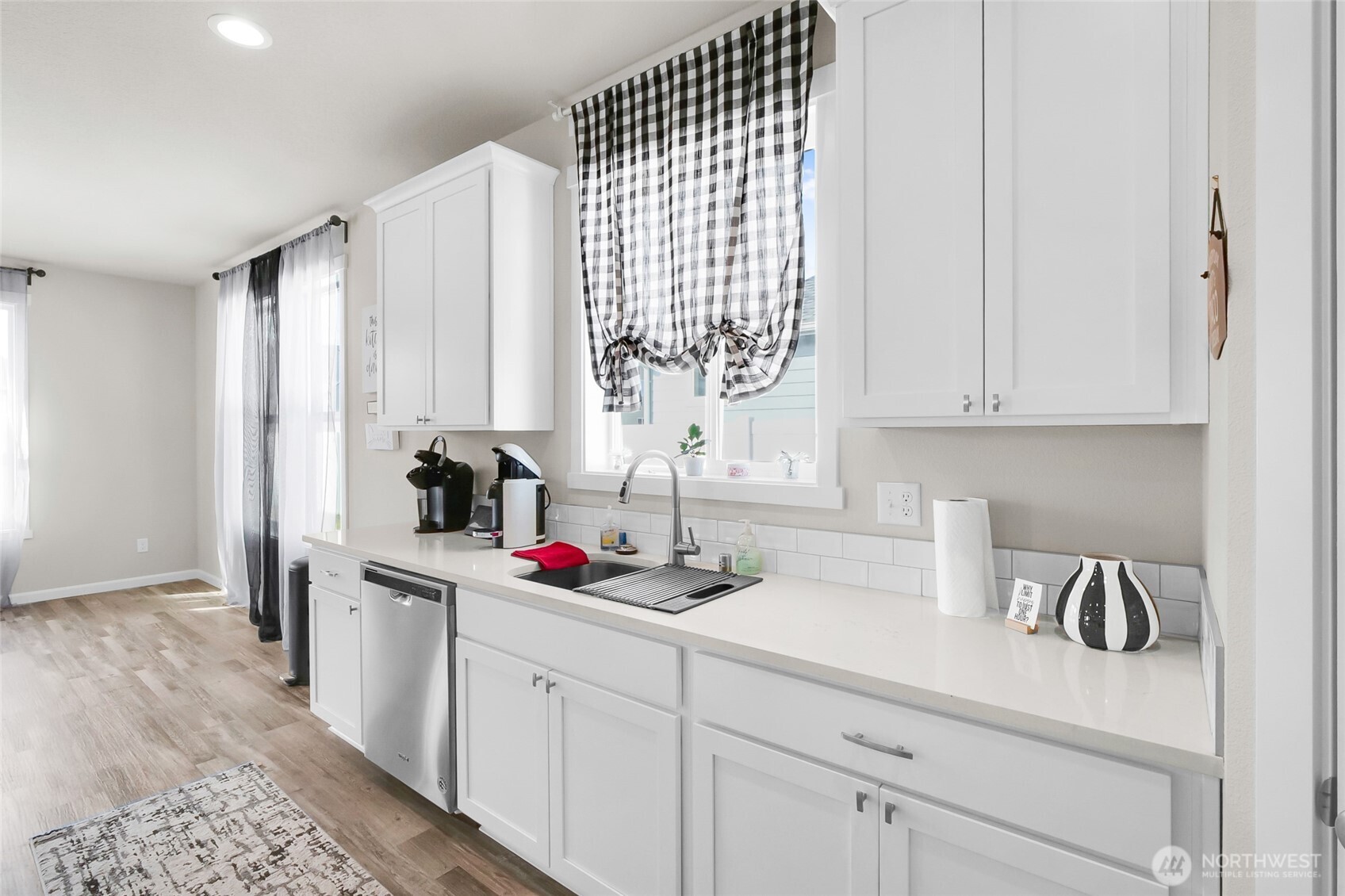 4705 West Merlin Street Moses Lake, WA 98837 - Photo 14 of 33 a kitchen with white cabinets and window
