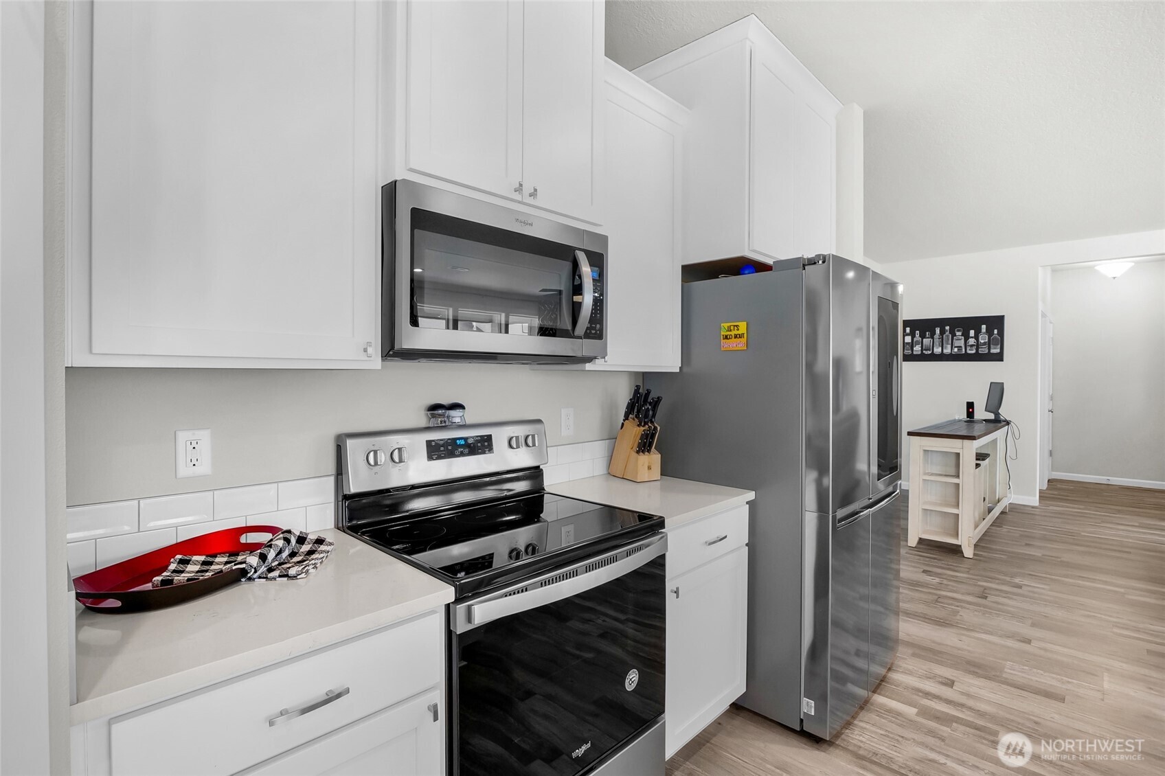 4705 West Merlin Street Moses Lake, WA 98837 - Photo 18 of 33 a kitchen with a stove and a microwave