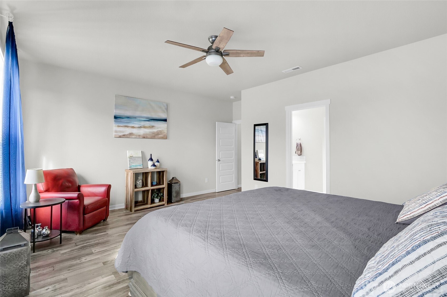 4705 West Merlin Street Moses Lake, WA 98837 - Photo 20 of 33 a bedroom with bed and a chandelier