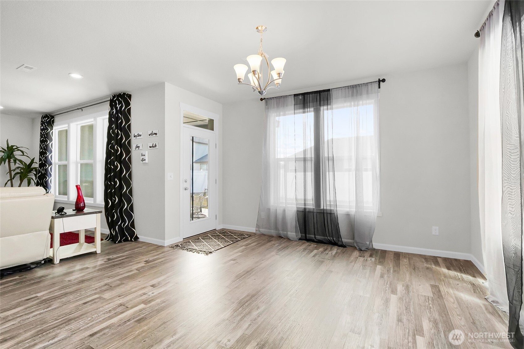 4705 West Merlin Street Moses Lake, WA 98837 - Photo 22 of 33 a view of an empty room with window and wooden floor