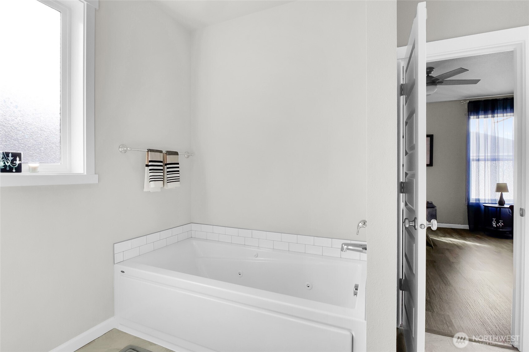 4705 West Merlin Street Moses Lake, WA 98837 - Photo 23 of 33 a bathroom with a tub and a window