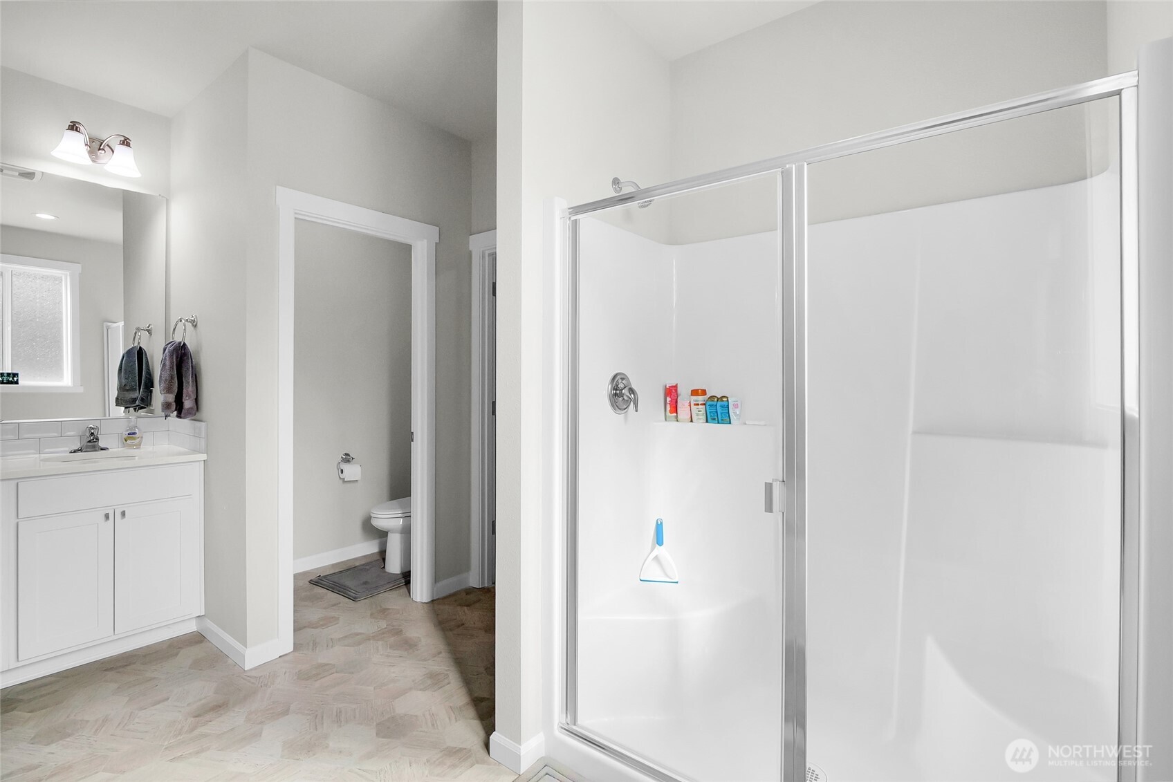 4705 West Merlin Street Moses Lake, WA 98837 - Photo 24 of 33 a bathroom with a shower and a sink