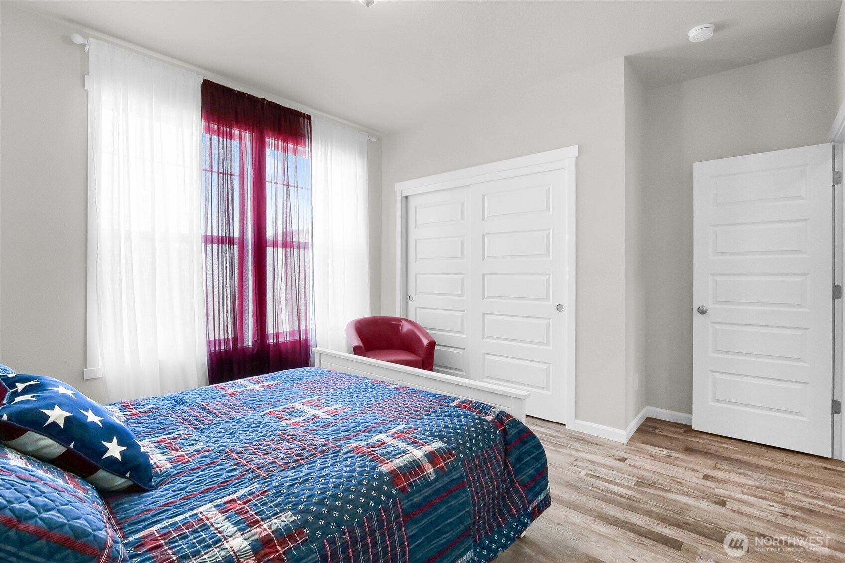 4705 West Merlin Street Moses Lake, WA 98837 - Photo 26 of 33 a bedroom with a bed and a window