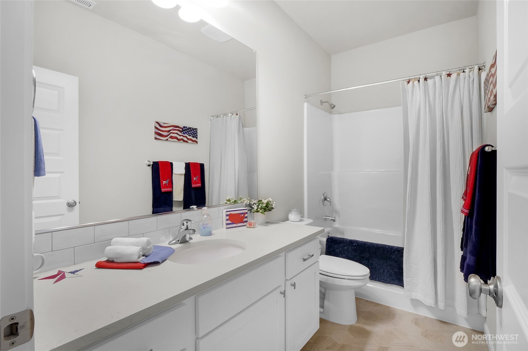 4705 West Merlin Street Moses Lake, WA 98837 - Photo 27 of 33 a bathroom with a sink vanity mirror and toilet
