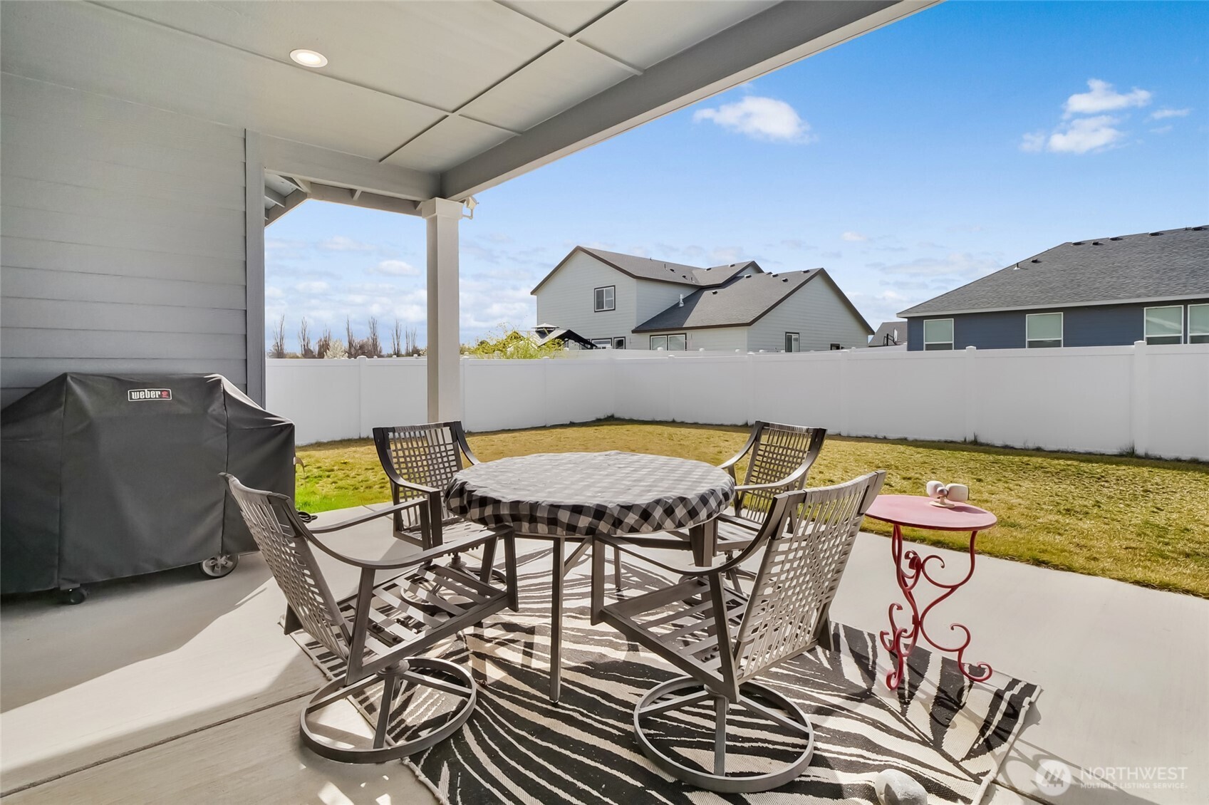 4705 West Merlin Street Moses Lake, WA 98837 - Photo 31 of 33 a view of a chairs and table in a patio
