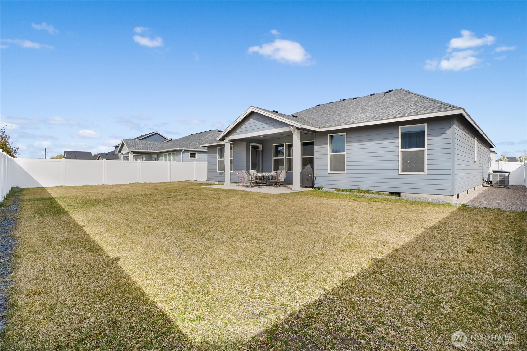 4705 West Merlin Street Moses Lake, WA 98837 - Photo 32 of 33 a view of a house with a yard