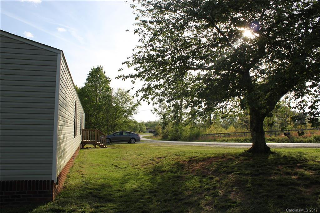 421 Cleghorn Mill Road, Unit 30 Rutherfordton, NC 28139 - Photo 23 of 23 a view of a yard with plants and a tree