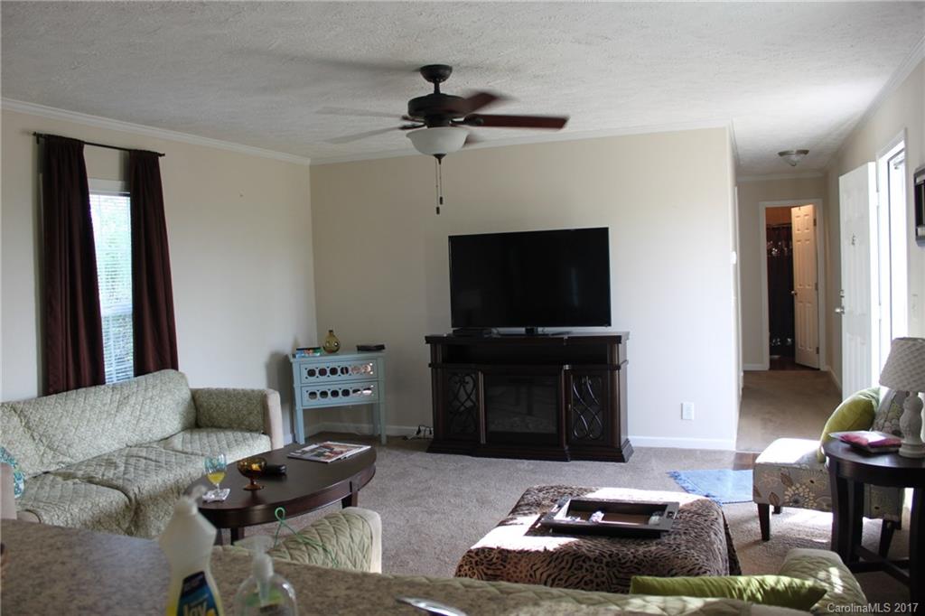 421 Cleghorn Mill Road, Unit 30 Rutherfordton, NC 28139 - Photo 6 of 23 a living room with furniture and a flat screen tv