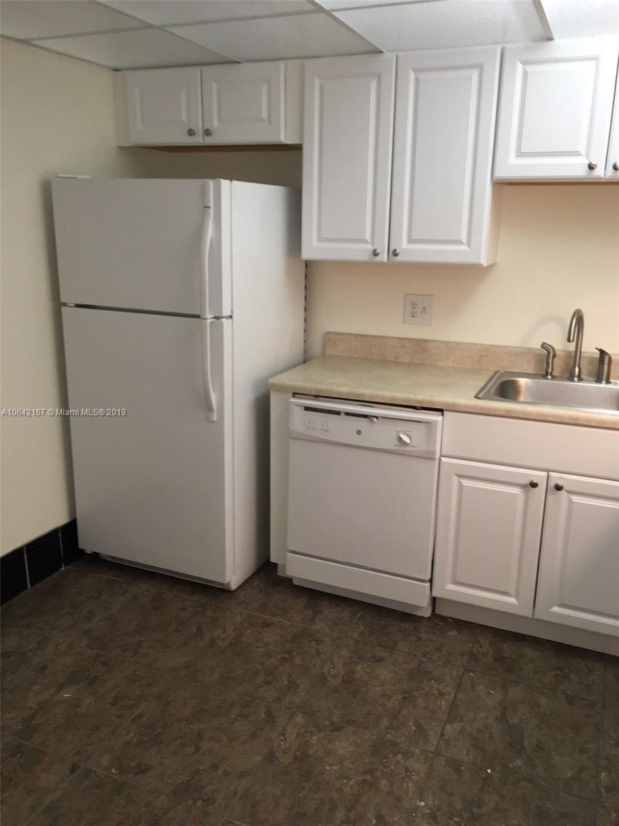4164 Inverrary Drive, Unit 813 Lauderhill, FL 33319 - Photo 15 of 25 a white refrigerator freezer sitting in a kitchen