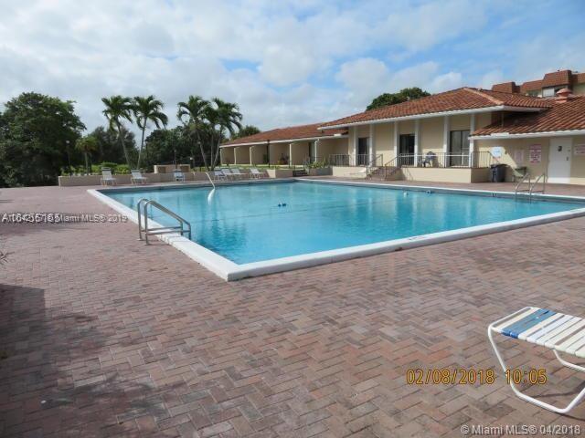 4164 Inverrary Drive, Unit 813 Lauderhill, FL 33319 - Photo 5 of 25 a view of a house with a swimming pool