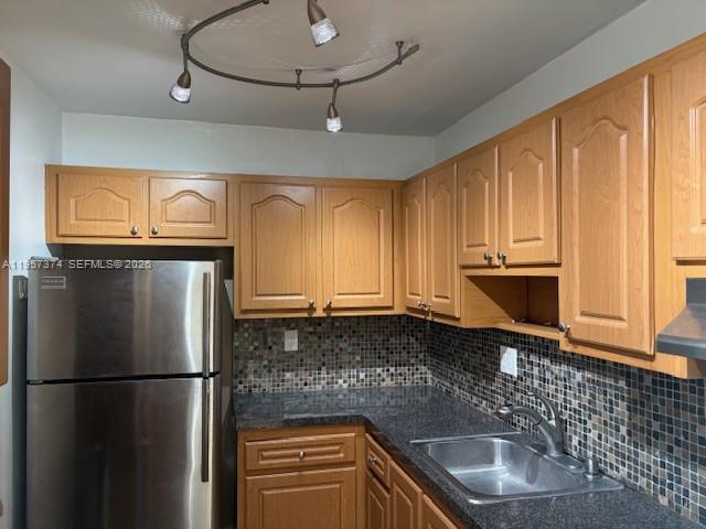 2201 Brickell Avenue, Unit 84 Miami, FL 33129 - Photo 2 of 7 a kitchen with a refrigerator a sink and cabinets