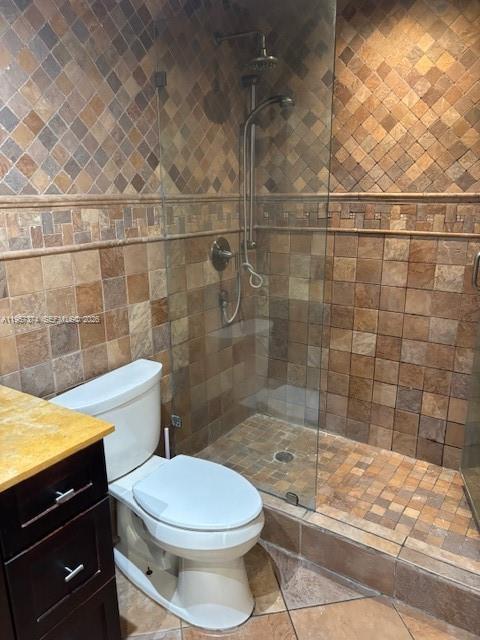 2201 Brickell Avenue, Unit 84 Miami, FL 33129 - Photo 5 of 7 a bathroom with a toilet a sink and shower