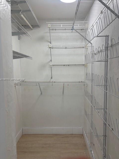 2201 Brickell Avenue, Unit 84 Miami, FL 33129 - Photo 7 of 7 a view of a room with racks on the wall