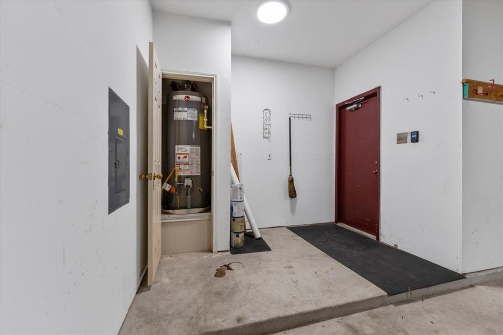 6752 MacIntosh Drive Plano, TX 75023 - Photo 34 of 40 Utilities featuring water heater and electric panel