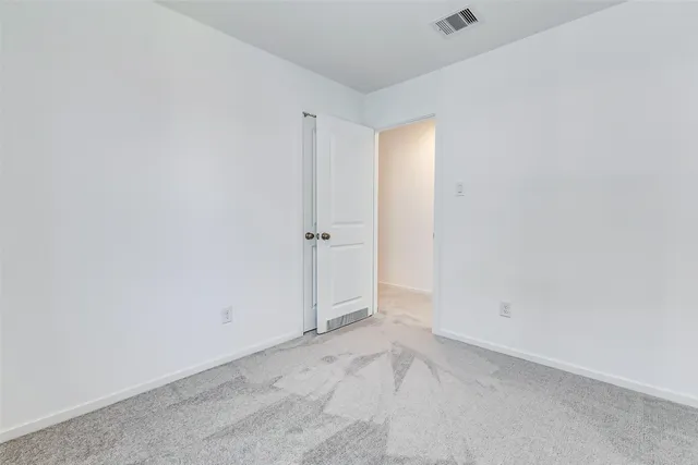 a view of a hallway with washer and dryer