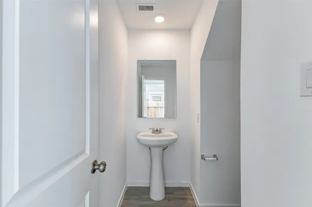 a bathroom with a sink a mirror and a