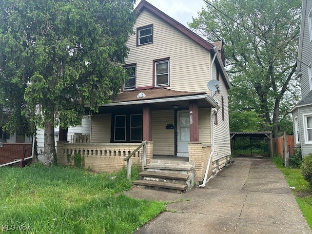 973 Stevenson Road Cleveland, OH 44110 - Photo 1 of 25 View of front facade featuring covered porch