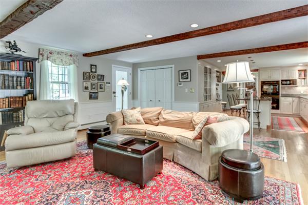 429 Linebrook Road Ipswich, MA 01938 - Photo 14 of 30 a living room with furniture and a book shelf