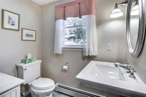 429 Linebrook Road Ipswich, MA 01938 - Photo 15 of 30 a bathroom with a sink a toilet and mirror