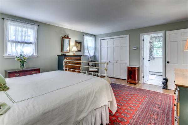 429 Linebrook Road Ipswich, MA 01938 - Photo 17 of 30 a bed room with a bed and a television