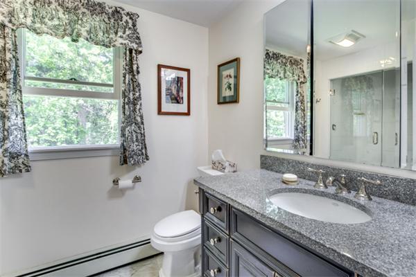429 Linebrook Road Ipswich, MA 01938 - Photo 19 of 30 a bathroom with a granite countertop sink toilet and mirror