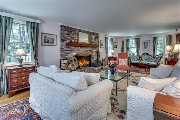 429 Linebrook Road Ipswich, MA 01938 - Photo 4 of 30 a living room with furniture a fireplace and a large window