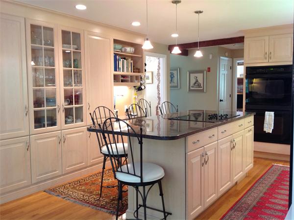 429 Linebrook Road Ipswich, MA 01938 - Photo 9 of 30 a kitchen with granite countertop a table chairs stove and cabinets