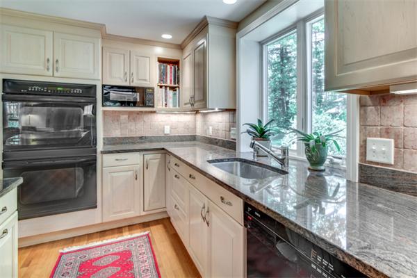 429 Linebrook Road Ipswich, MA 01938 - Photo 10 of 30 a kitchen with stainless steel appliances granite countertop a sink a stove and a microwave