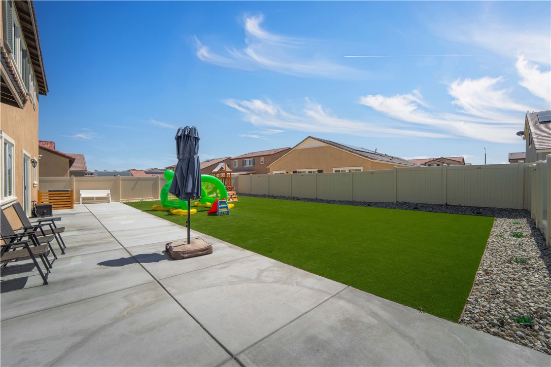 4422 Jade Court Lancaster, CA 93536 - Photo 17 of 44 a park view with a bench and trees