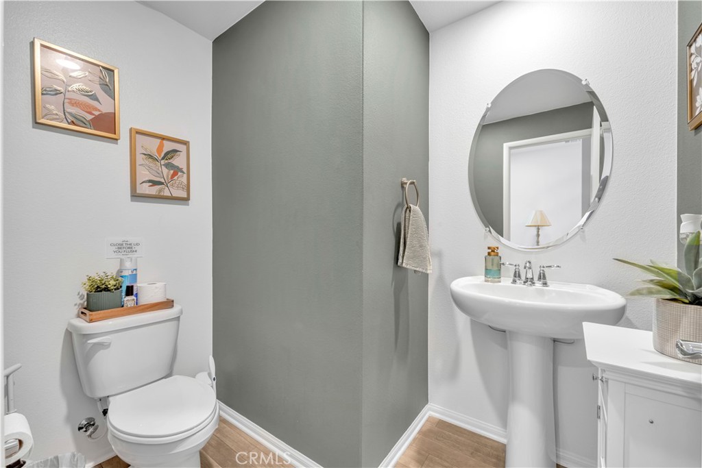 4422 Jade Court Lancaster, CA 93536 - Photo 21 of 44 a bathroom with a toilet sink and mirror