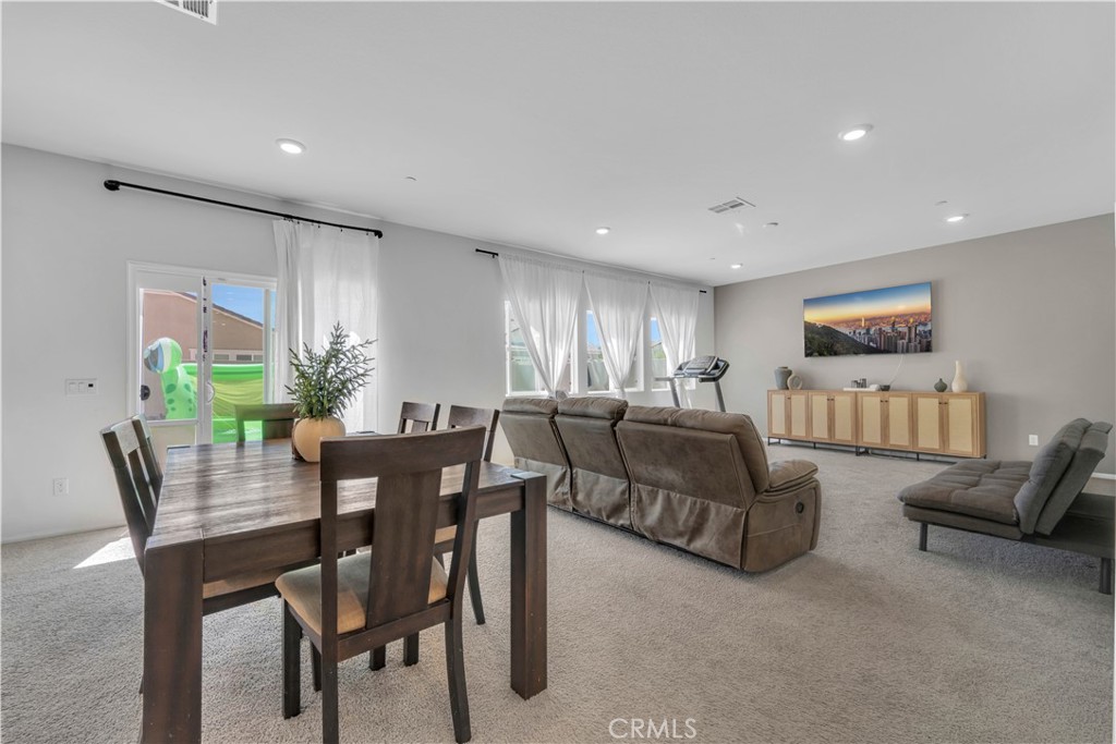 4422 Jade Court Lancaster, CA 93536 - Photo 23 of 44 a view of a livingroom with furniture and a potted plant
