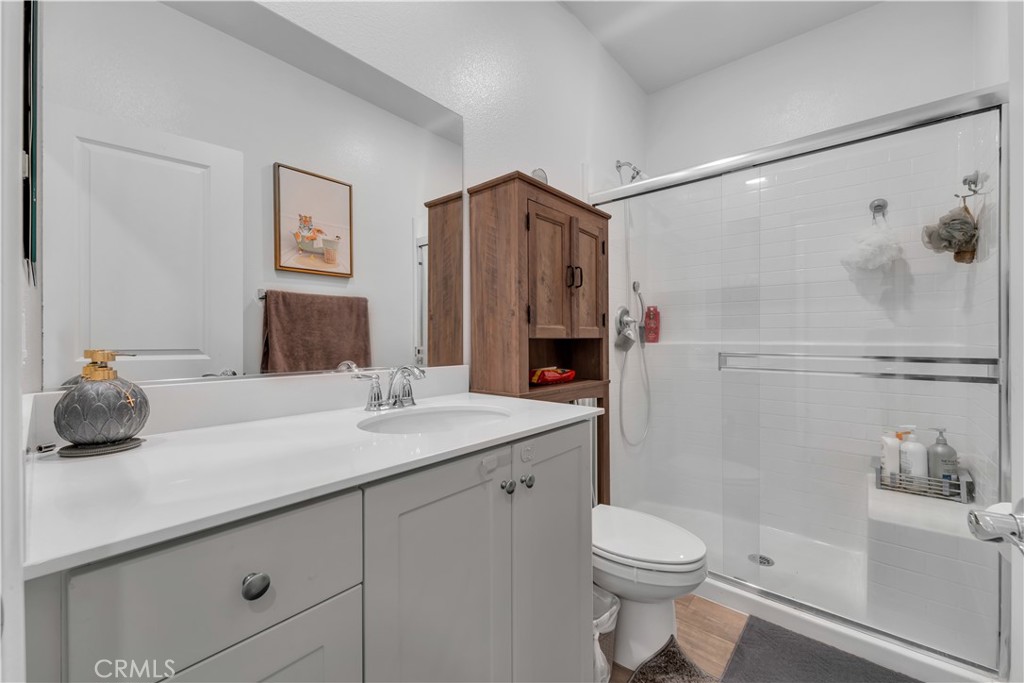 4422 Jade Court Lancaster, CA 93536 - Photo 43 of 44 a bathroom with a sink a toilet and shower