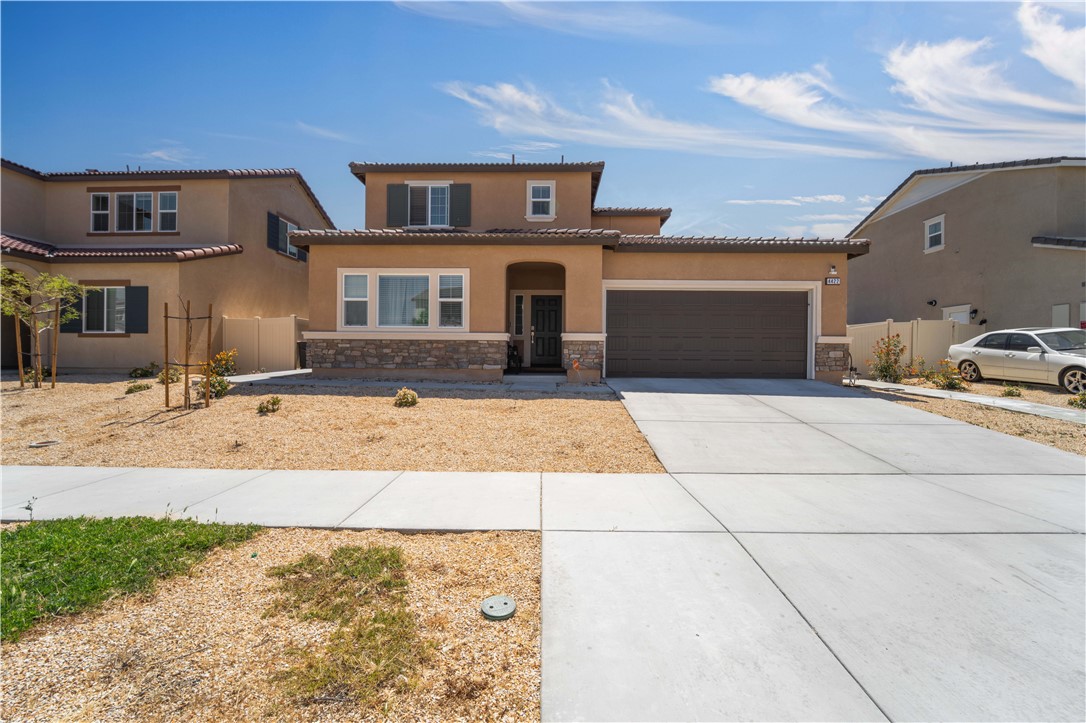 4422 Jade Court Lancaster, CA 93536 - Photo 10 of 44 a front view of a house with a yard