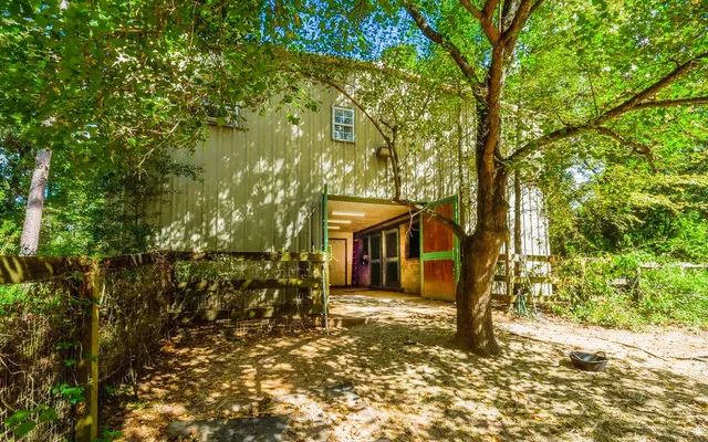 a spacious bedroom with a bed and a walk in closet